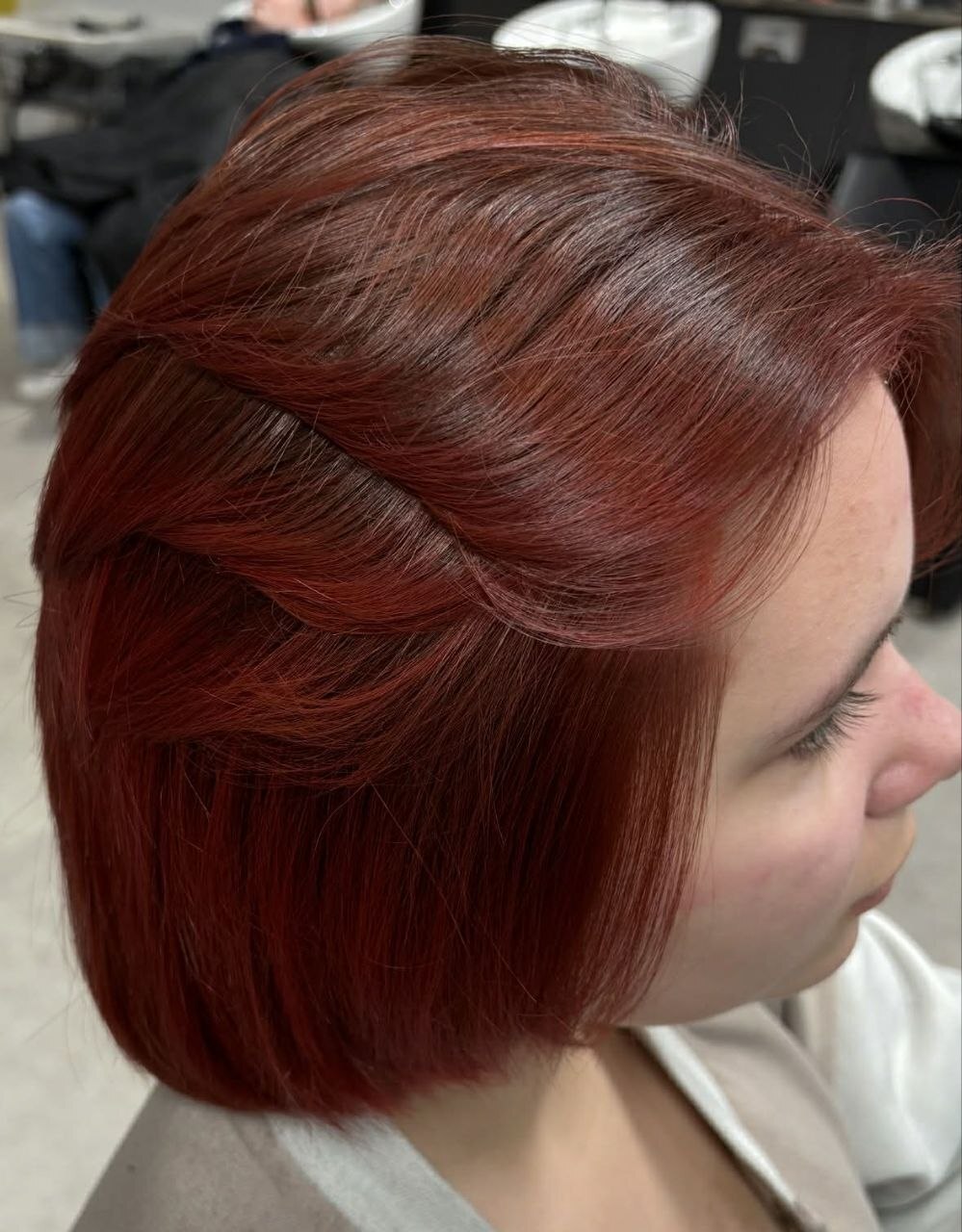 Rich red polished hairstyle by The Chikas Studio